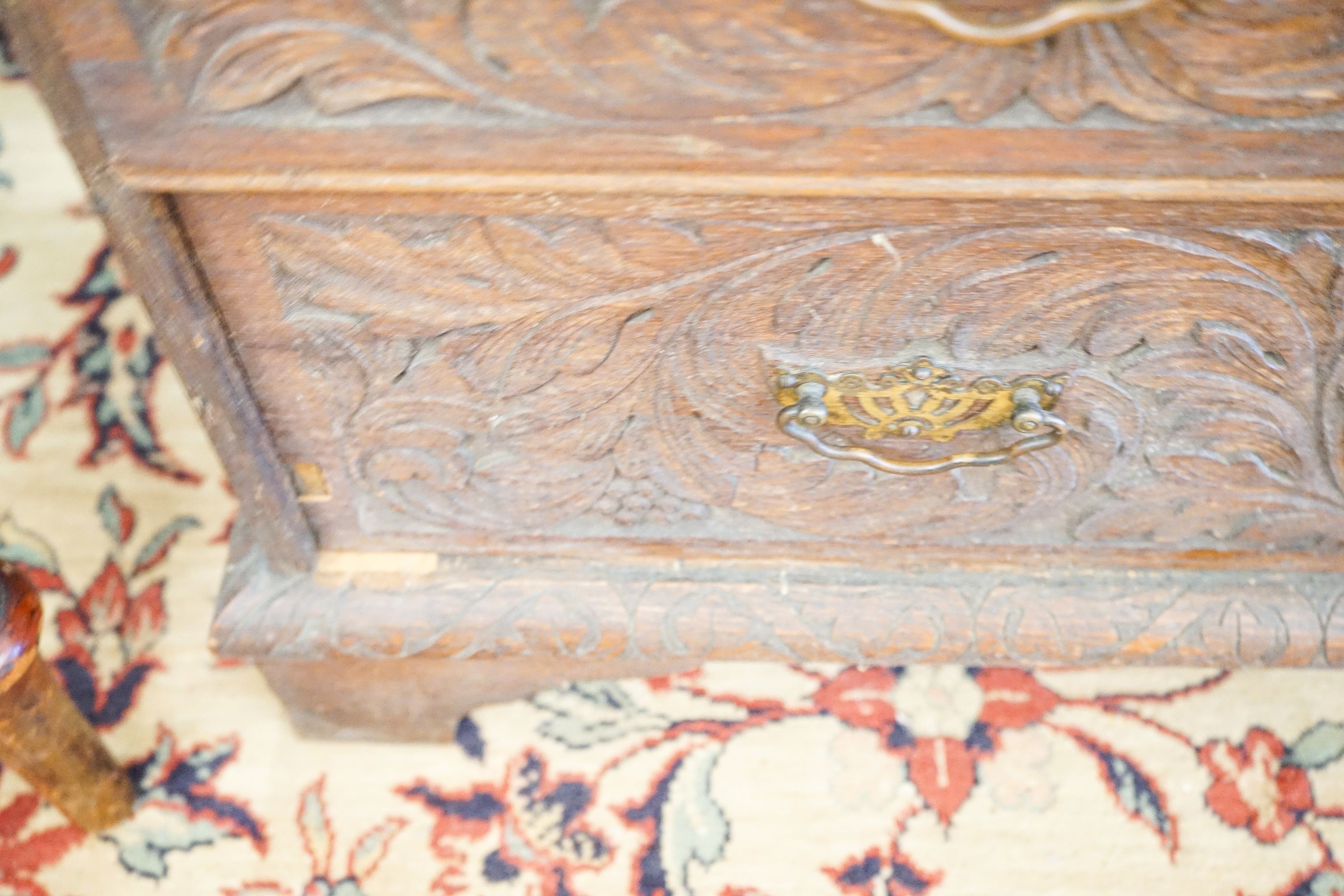 An 18th century later carved oak bureau, width 91cm, depth 53cm, height 101cm